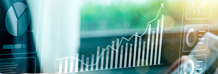 Growth image for detail page, showing business person sitting at desk viewing imagery showing upward movement